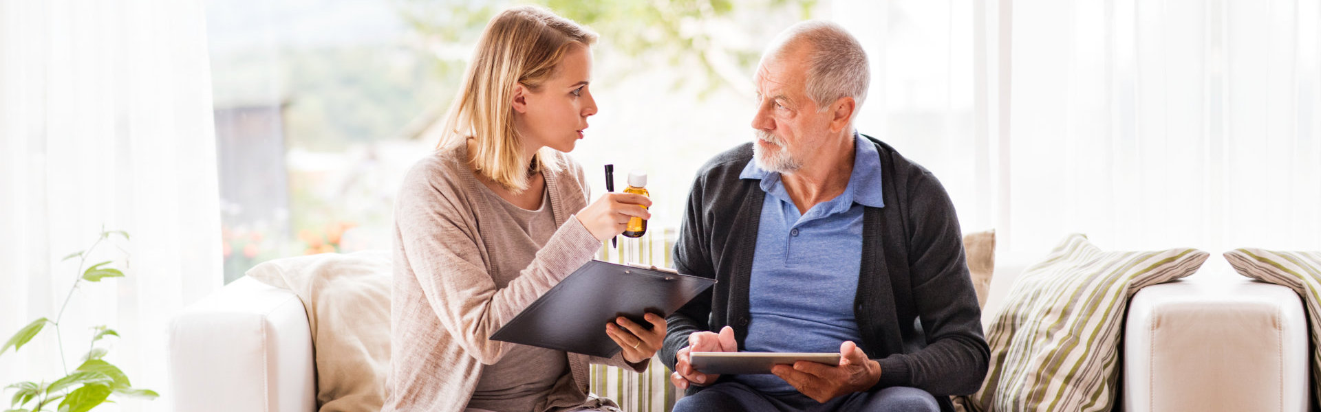 nurse and senior talking